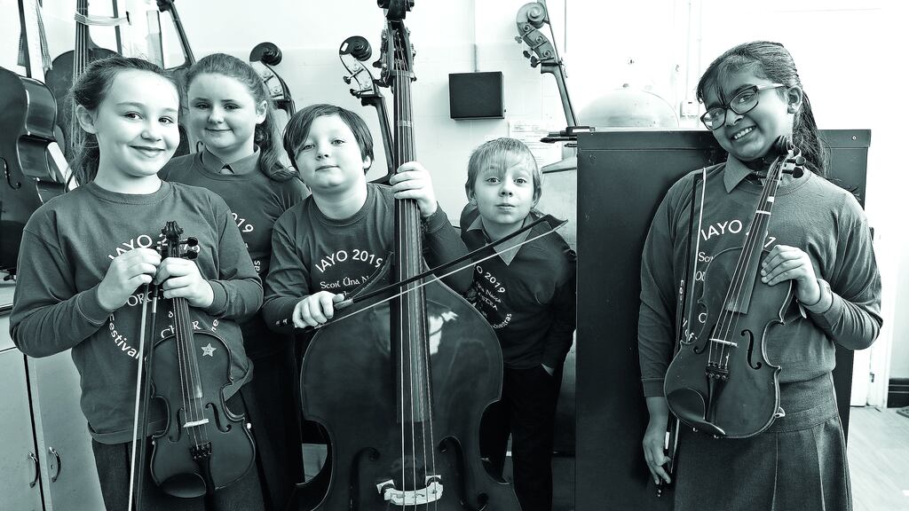 Pupils from Scoil Úna Naofa in Crumlin preparing for their performance in the National Youth Orchestra festival. Photograph: Marc O’Sullivan