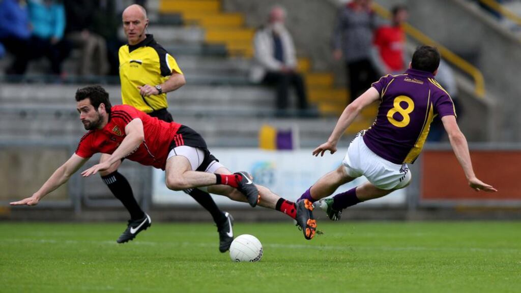 Down’s Kevin McKernan collides with   Syl Byrne of Wexford during the  All-Ireland SFC Round 1B Qualifier at  Wexford Park. Photograph: Donall Farmer/Inpho
