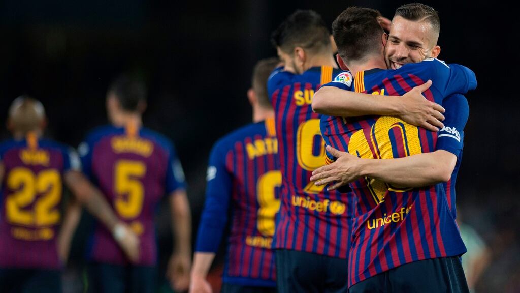 Lionel Messi and Jordi Alba after Barcelona’s second goal against Real Betis at the Benito Villamarin stadium in Seville. Photograph: Getty Images