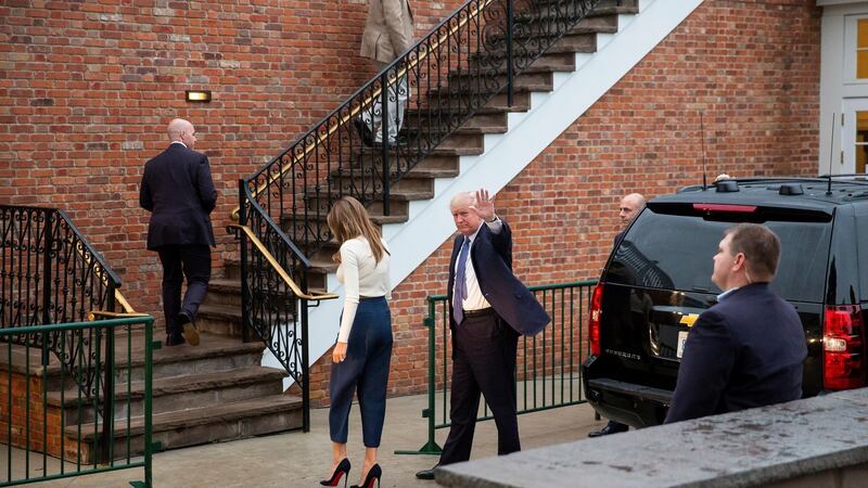 Trump and first lady Melania Trump head to the clubhouse. Photo: Eric Thayer/The New York Times