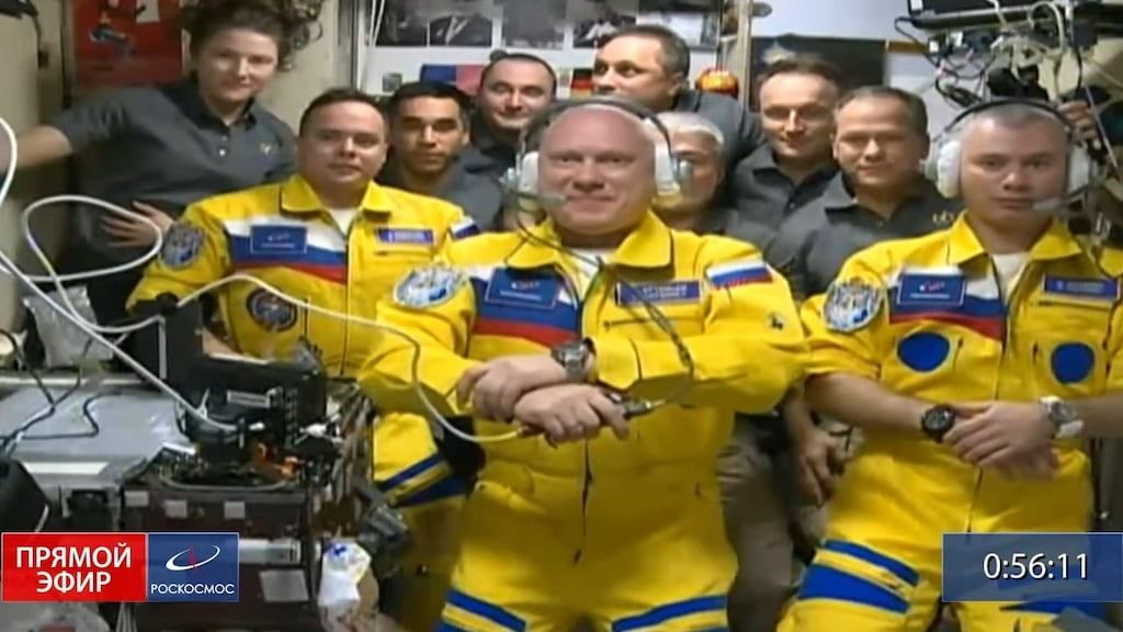 Russian cosmonauts Sergey Korsakov, Oleg Artemyev and Denis Matveyev in their yellow suits after arriving at the International Space Station on Friday. Photograph: Screen grab from video provided by Russia’s Roscosmos