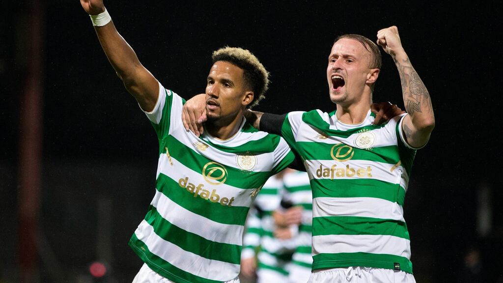 Celtic’s Scott Sinclair celebrates scoring his side’s first goal with Leigh Griffiths during the Betfred Cup quarter-final against Dundee at Dens Park. Photograph: Jeff Holmes/PA Wire