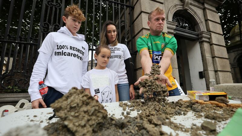 Amanda and Paddy Diver with their children Reece and Savannah outside Leinster House on Thursday with samples of defective building blocks. Photograph: Nick Bradshaw