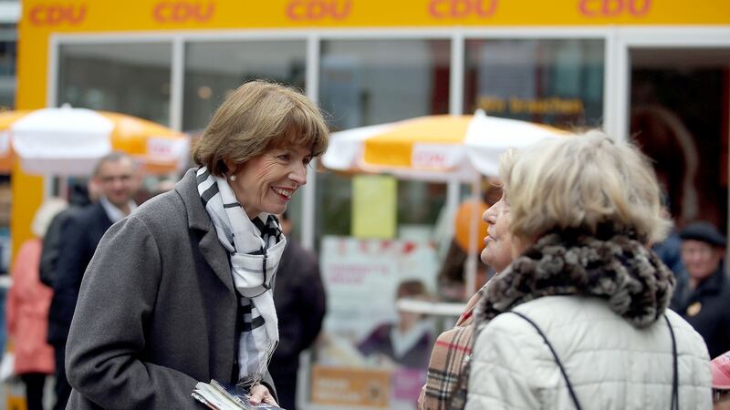 File photograph of Henriette Reker talking to people on Friday on the election trail in Cologne. Photograph: Oliver Berg/dpa via AP