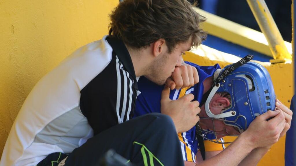 Clare’s Shane O’Donnell consoles Podge Collins after he was sent off in the All-Ireland SHC qualifier at Cusack Park, Ennis last Saturday. Photograph: Cathal Noonan/Inpho