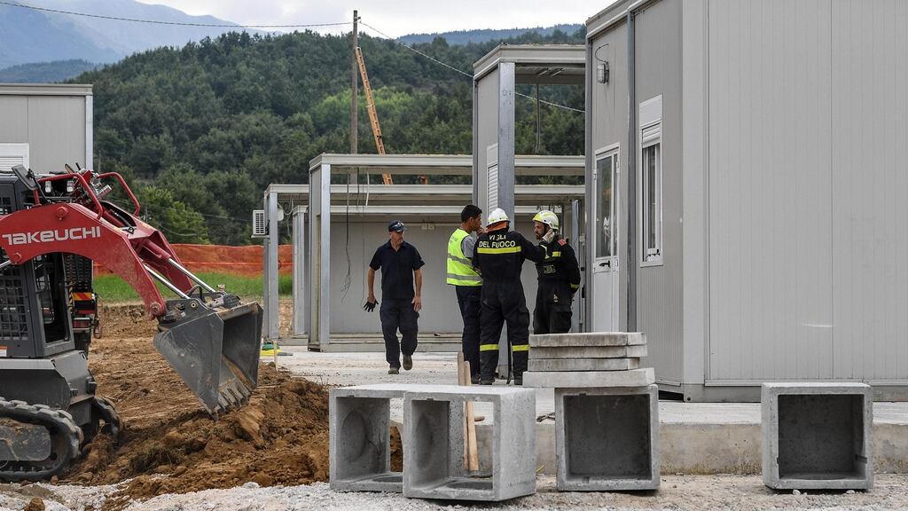 Workers build a new school in Amatrice, Italy. Photograph: Alessandro Di Meo/EPA