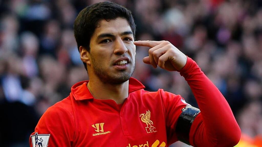 Liverpool captain Steven Gerrard believes Luis Suarez will stay at the club once his ban is completed. Photograph: Phil Noble/Reuters