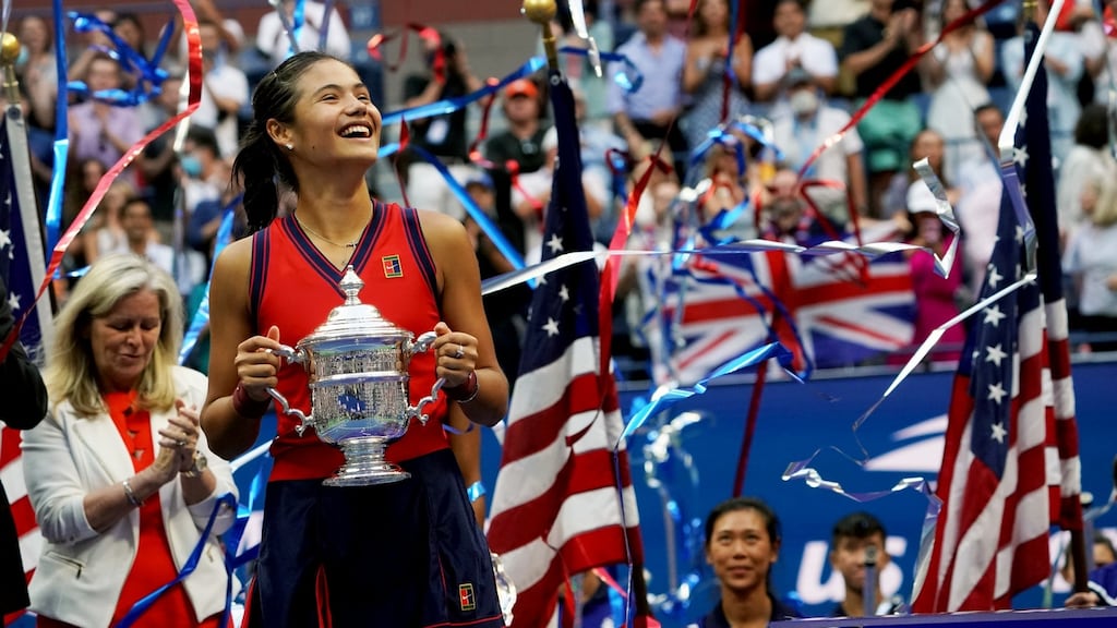 Emma Raducanu holds the US Open trophy after winning at FLushing Meadows. Photo: Michelle V. Agins/The New York Times
