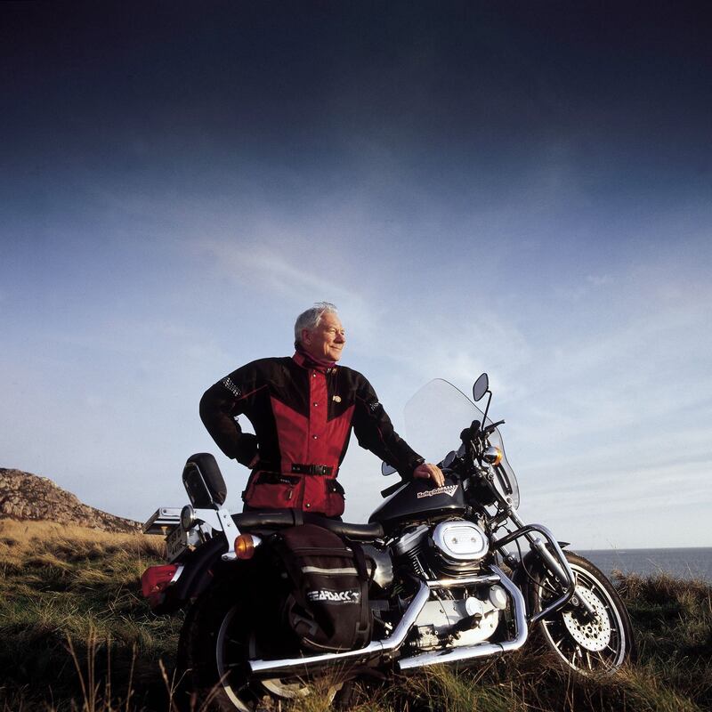 Gay Byrne with the Harley-Davidson that Larry Mullen and Bono of U2 gave him on his final Late Late Show, in 1999. Photograph: Peter Rowen