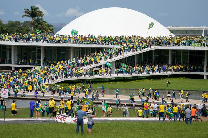 Supporters of Brazil’s former president Jair Bolsonaro storm the congress building in Brasília. Photograph: Eraldo Peres/AP/PA