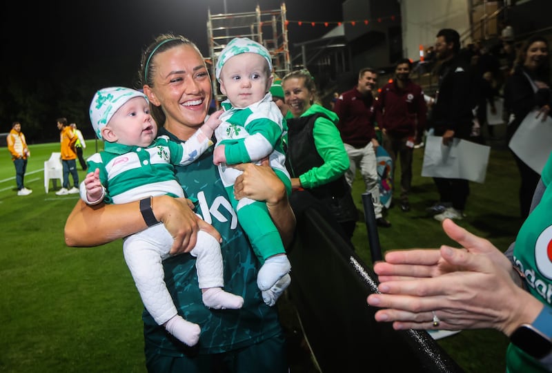 Ireland captain Katie McCabe with six-month-old twins Finín and Meadhbh Murphy from Brisbane during the open training session at Meakin Park in Brisbane. Photograph: Ryan Byrne/Inpho