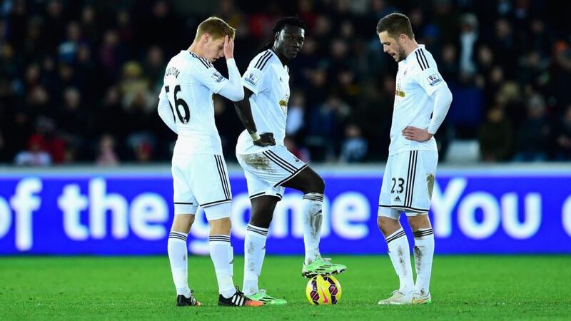 Swansea players prepare to kick off after going 5-0 down to Chelsea at Liberty Stadium. Photograoh: Stu Forster/Getty Images