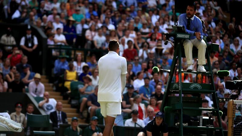 Nick Kyrgios speaks with the match umpire during his defeat to Rafael Nadal. Photograph: Adam Davy/PA