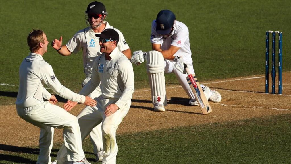 Kane Williamson, Brendon McCullum and Hamish Rutherford of New Zealand celebrate the wicket of England captain Alastair Cook during day four of the third Test in Auckland. Photograph: Phil Walter/Getty Images