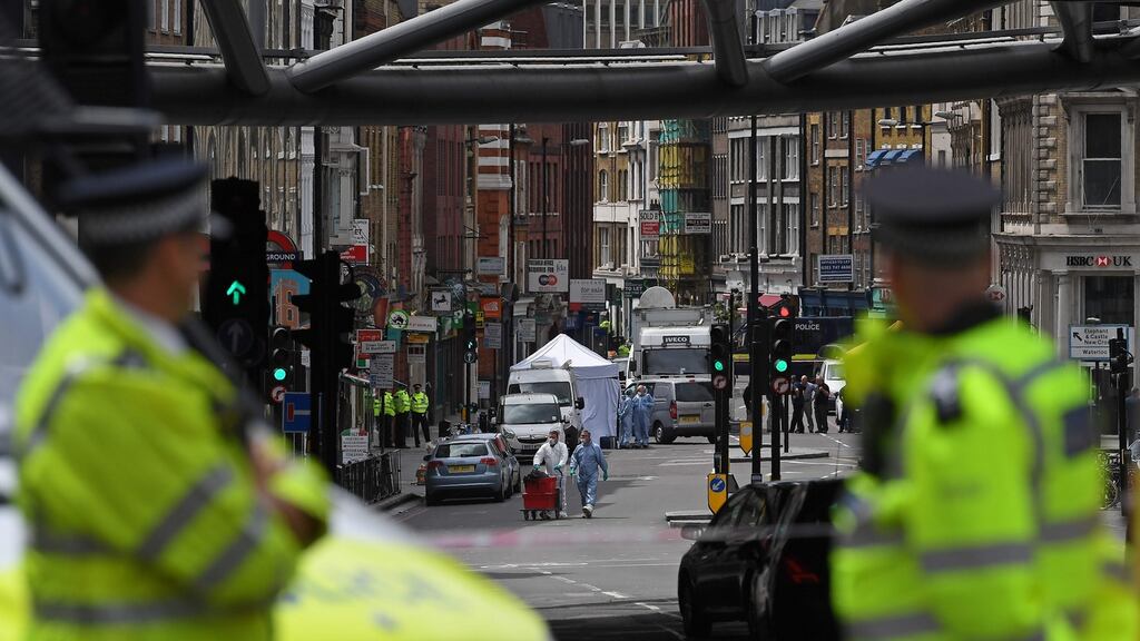 Police forensic officers on Borough High Street, close to Borough Market, after the terror attack which left seven people dead. Photograph: AFP/Justin Tallis/Getty Images