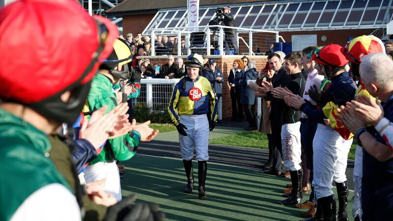Noel Fehily gets a guard of honour from his fellow jockeys as he heads out to take the final ride of his career on Get In The Queue at Newbury. Photograph: Julian Herbert/PA Wire