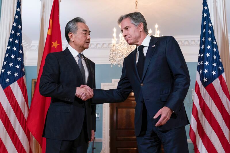 Secretary of state Antony Blinken shake hands with China’s foreign minister Wang Yi after a bilateral meeting in Washington. Photograph: Jose Luis Magana/AP