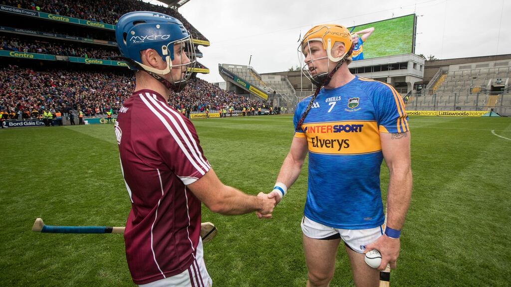 Galway’s Johnny Coen shakes hands with Tipperary captain Pádraic Maher after the game. Photograph: Ryan Byrne/Inpho