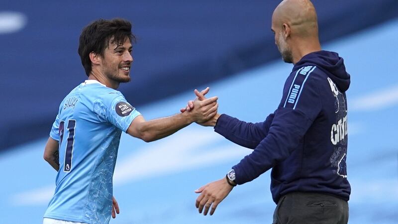 David Silva and Manchester City manager Pep Guardiola. Photograph: Dave Thompson/EPA