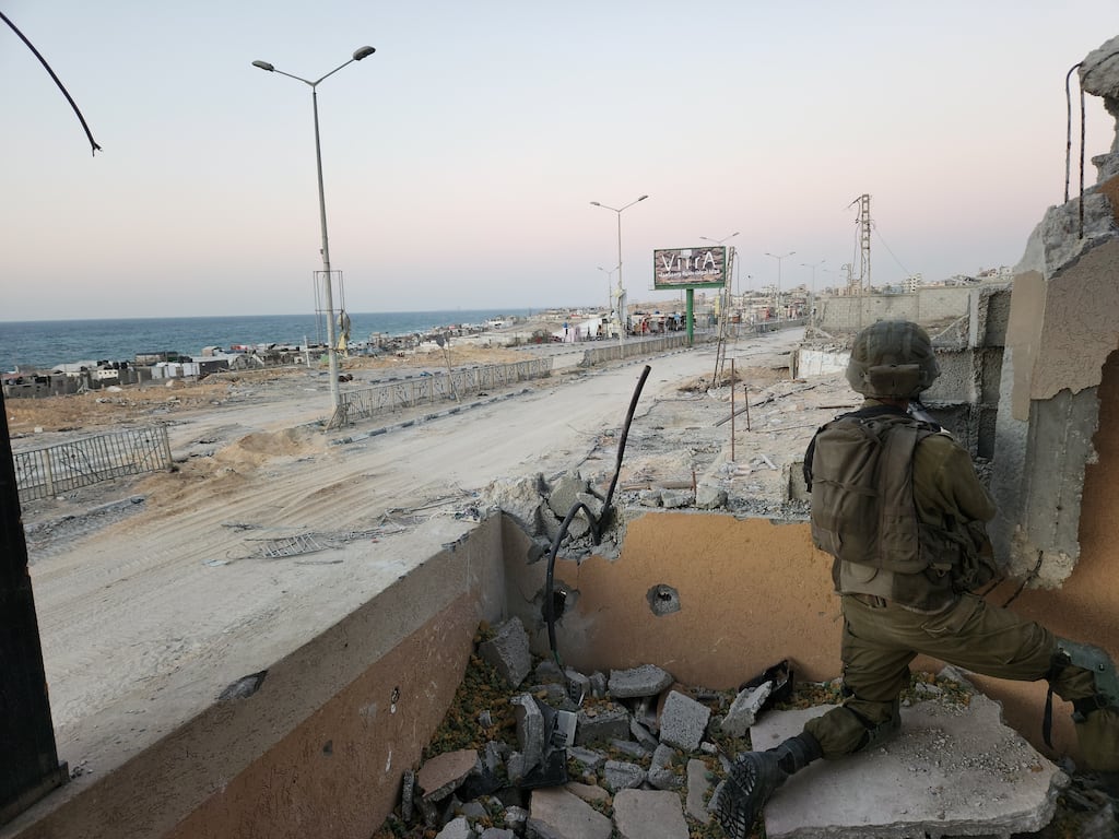 Israeli military personnel that a small group of journalists were permitted to accompany in northern Gaza for a few hours hold a position within sight of the coast on Saturday. Photograph: Ronen Bergman/The New York Times