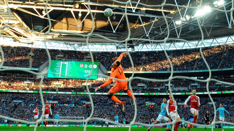 Aguero lobs Petr Cech for the opening goal of the game. Photo: Glyn Kirk/Getty Images