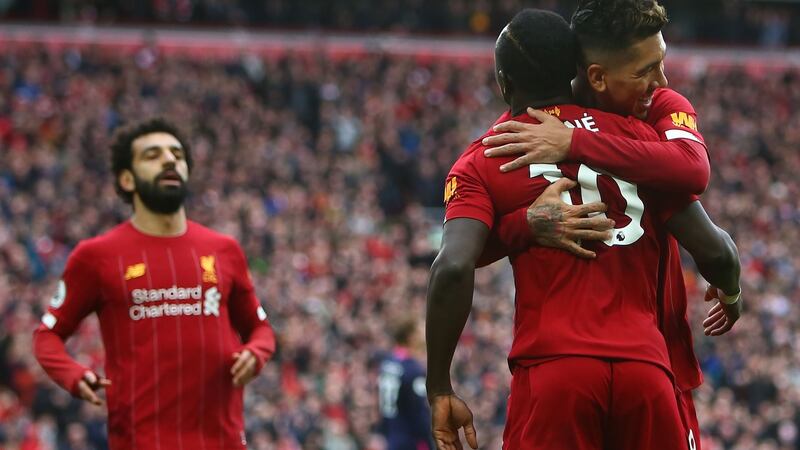 Sadio Mane with Roberto Firmino after scoring at Anfield. Photograph: Getty Images