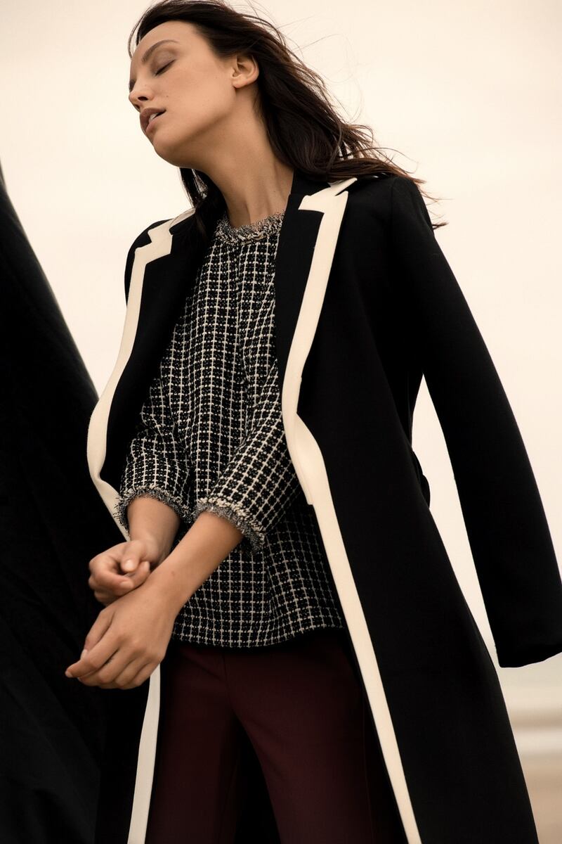 Black and white coat €149, black blouse €69.95, straight leg trouser in Bordeaux €99