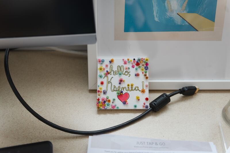 Artwork on the desk of Kseniia Petrova, a scientist who fled Russia after protesting its invasion of Ukraine, at Harvard. Photograph: Lucy Lu/The New York Times