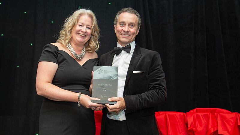 Mary Cloonan, founder, Marketing Clever, presents the Tax Team of the Year award to Feargal McCormack, FPM.