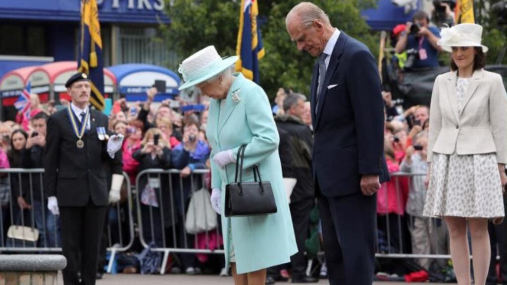 Queen Elizabeth and the Duke of Edinburgh at the Cenotaph in Coleraine.