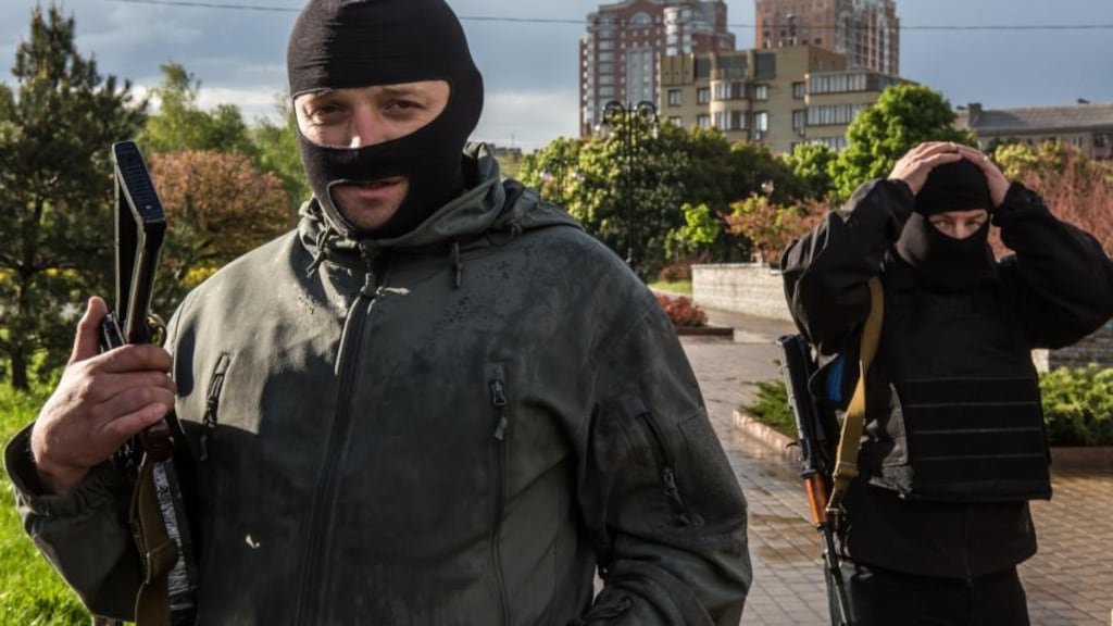 Pro-Russian activists outside the occupied regional administration building in Donetsk, which serves as their local headquarters. Photograph: Brendan Hoffman/Getty Images
