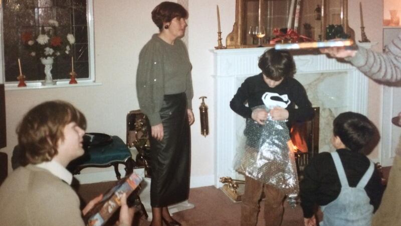 Unwrapping presents during a family Christmas