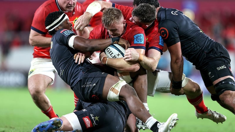 Munster’s Gavin Coombes is tackled by Phepsi Buthelezi of the Sharks at Thomond Park. Photograph: Laszlo Geczo/Inpho