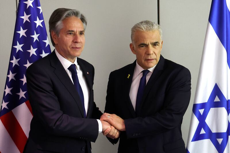 US secretary of state Antony Blinken (left) shakes hands with Israeli opposition leader Yair Lapid during a meeting in Tel Aviv. Photograph: Jack Guez/AP