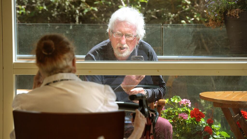 Loveday Quinn receives a visit from her husband Noel at Belmont House Nursing Home in Stillorgan, Dublin. Photograph: Dara Mac Dónaill