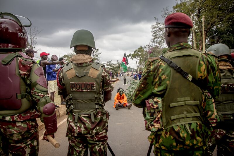 Kenyan police form a barrier against Raila Odinga supporters outside Kenya's national tallying centre in Nairobi on Monday. Photograph: Sally Hayden