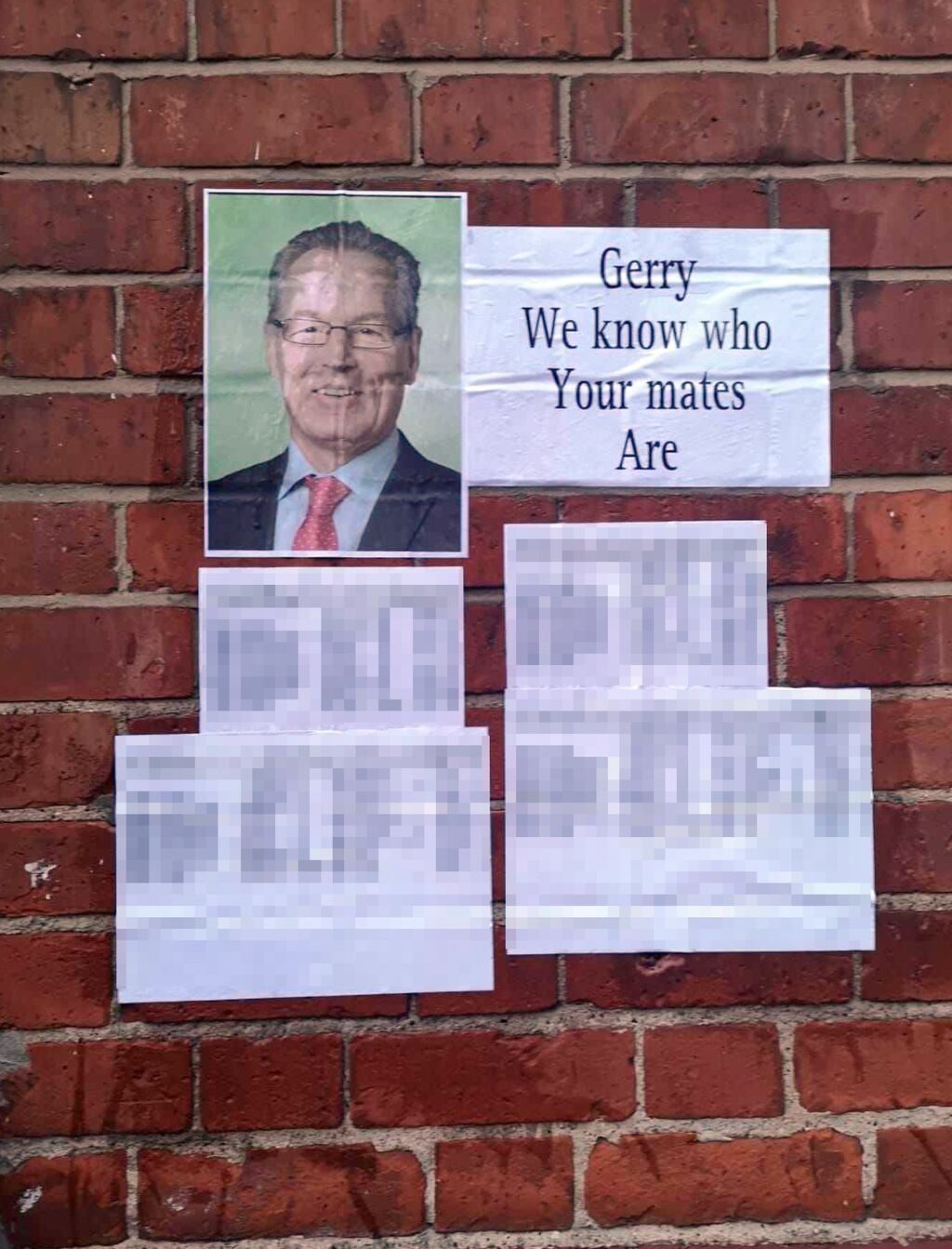 A redacted version of a leaked document that listed the names of police officers in Northern Ireland was posted on a wall facing a Sinn Fein office in Belfast. Photograph: Twitter