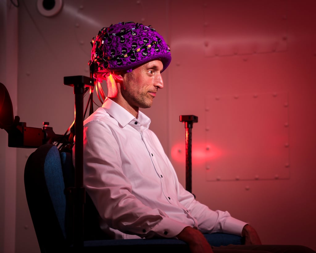 Prof Redmond O’Connell from the school of psychology and institute of neuroscience at Trinity College Dublin wearing the MEG brain scanner system. Photograph: Chris Bellew