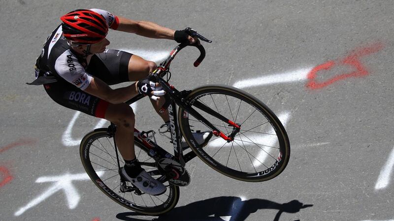 Sam Bennett of Ireland riding for Bora-Argon 18 rides on one wheel up the Col du Tourmalet during stage eight of the 2016 Tour de France. Photograph: Chris Graythen/Getty Images
