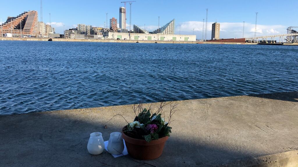 Flowers and candles marks the site where the body of Peter Burns was found in the water in the harbour of Aarhus, Denmark. Photograph: Marie Schønning Jensen