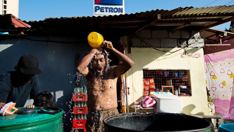 Washing in the Binondo district of Manila, the Philippines. Photograph: SeongJoon Cho/Bloomberg via Getty Images