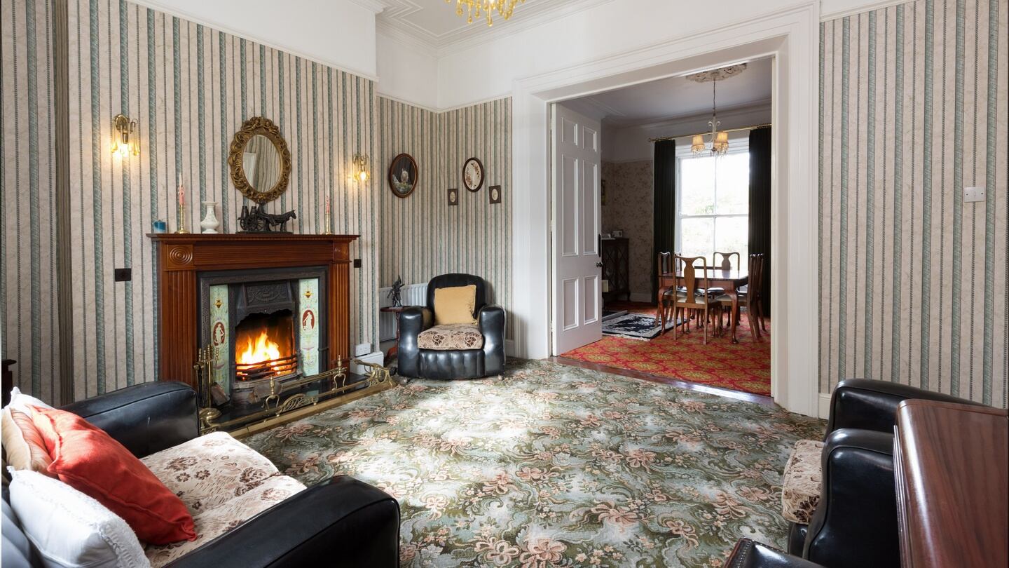 The reception room has a 13ft-high cieling.