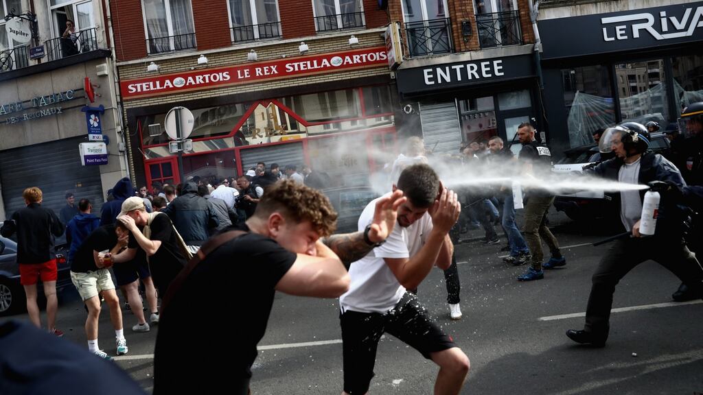 English fans clash with police in Lille, France. Photograph: Carl Court/Getty Images.