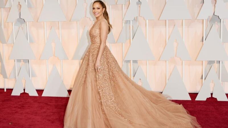 Jennifer Lopez was perhaps THE golden girl of this year’s awards in nude-toned Elie Saab Couture. The huge gown also featured detailed appliqué and seemed to match almost exactly her glowing skin tone. The ever present awards guest let her dress do the talking with a simple ponytail and make-up. Photograph: Getty Images