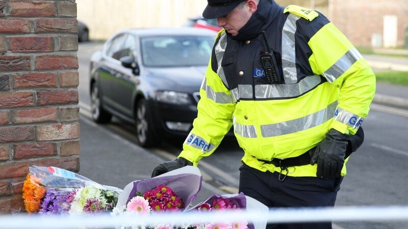 Flowers are seen outside the house where the bodies of three children were found in a house in Newcastle. Photograph: Collins