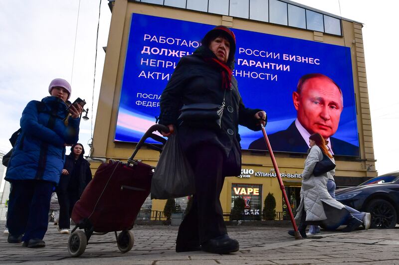 Image of Vladimir Putin in St Petersburg: Presidential elections will run over three days from Friday. Photograph: Olga Maltseva/AFP via Getty Images