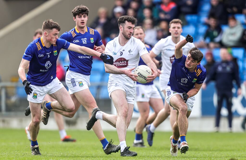 Kildare's Kevin Flynn is challenged by Matt Nolan, Jack Kirwan and Patrick O'Keane of Wicklow in the Leinster SFC quarter-final on April 14th. Photograph: Tom Maher/Inpho