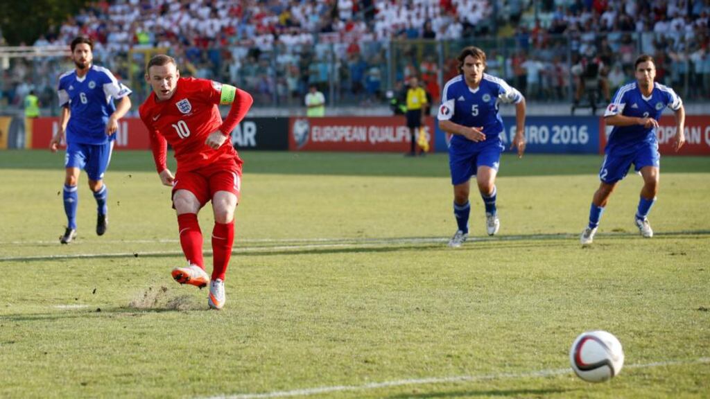 Wayne Rooney slots home from the penalty spot to equal Bobby Charlton’s mark of 49 goals in the Euro 2016 Group E qualifier against San Marino at Stadio Olimpico in Serravalle. Photograph: Carl Recine/Action Images via Reuters/Livepic