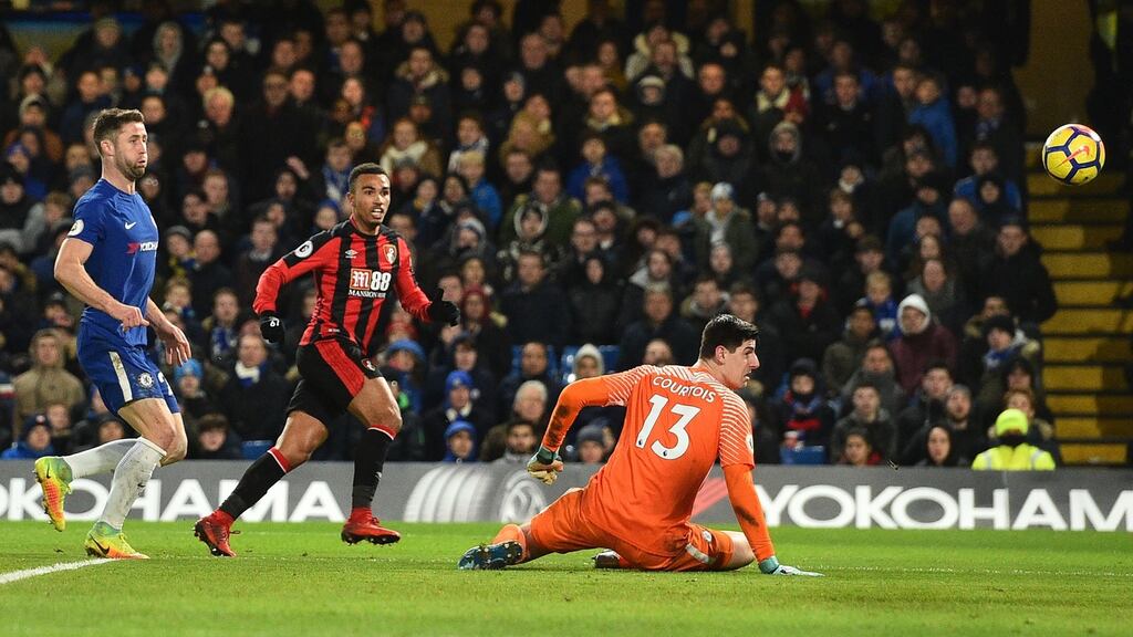 Bournemouth midfielder Junior Stanislas lifts the ball over Chelsea goalkeeper Thibaut Courtois during the Premier League game at Stamford Bridge. Photograph: Glyn Kirk/AFP/Getty Images