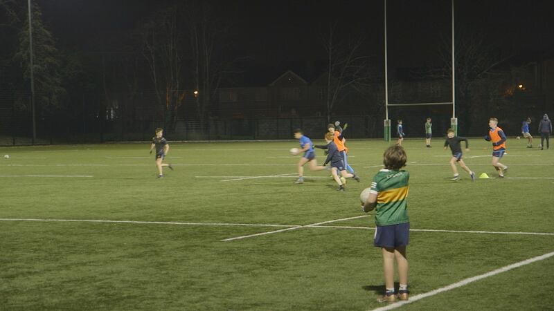 A Ranelagh Gaels underage training session takes place in Gonzaga College under floodlights.
